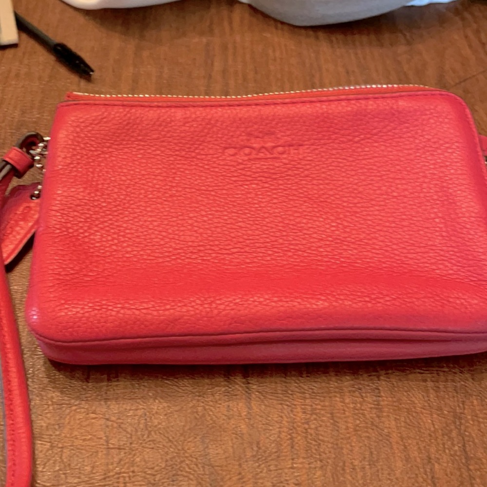 coral/pink little hand bag from coach never used!